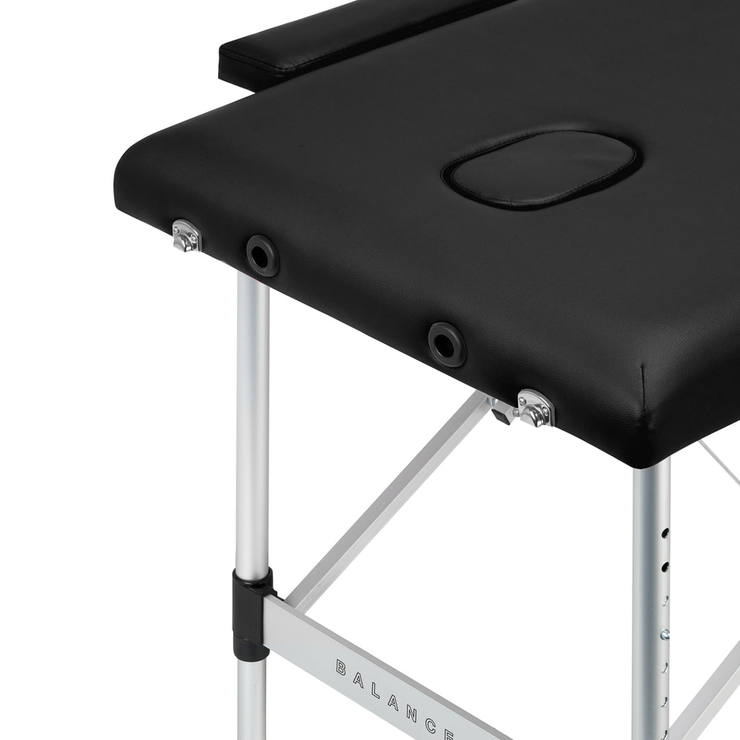 Lettino da massaggio pieghevole in alluminio Balance 2 zone nero