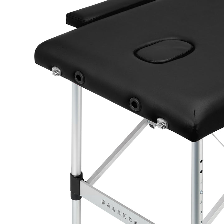 Lettino da massaggio pieghevole in alluminio Balance 2 zone nero